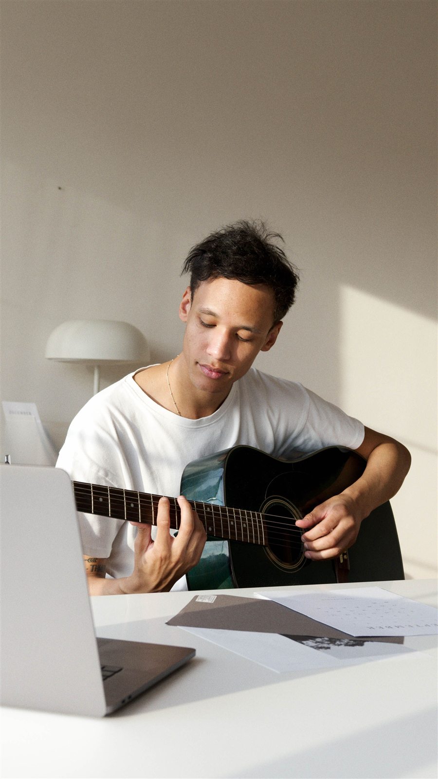Returning players learning guitar